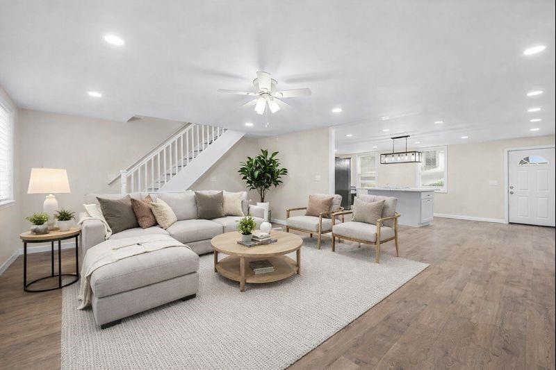 4617 Mt Troy Rd Extension Pittsburgh, PA 15214 - Photo 6 of 19 a living room with furniture and a chandelier