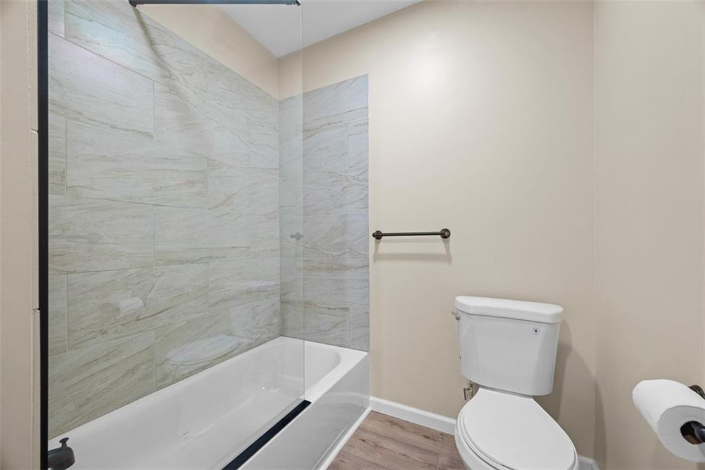 4617 Mt Troy Rd Extension Pittsburgh, PA 15214 - Photo 9 of 19 a bathroom with a toilet and a bathtub