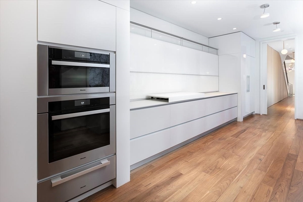 21 Chestnut Street Boston, MA 02108 - Photo 6 of 24 a kitchen with a stove and a microwave