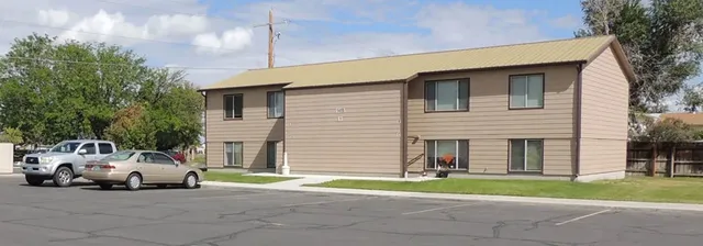 a view of a parked cars in front of a house