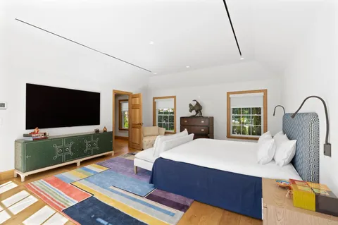 a living room with furniture rug and window