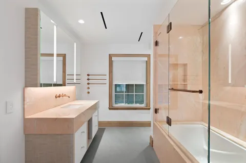 a bathroom with a shower and a tub