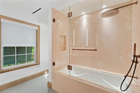 a living room with a bath tub and shower