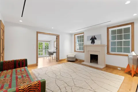 a bedroom with furniture and a fireplace