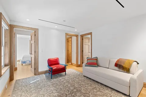 a living room with a couch and dresser