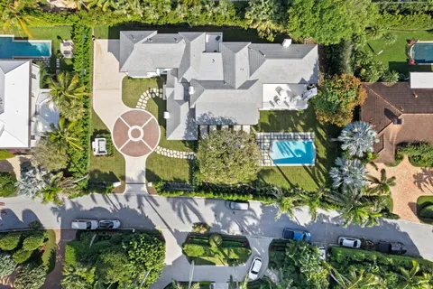 an aerial view of residential house with outdoor space and parking