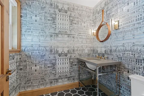 a bathroom with a sink and a mirror