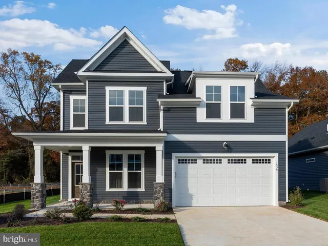 a front view of a house with a porch