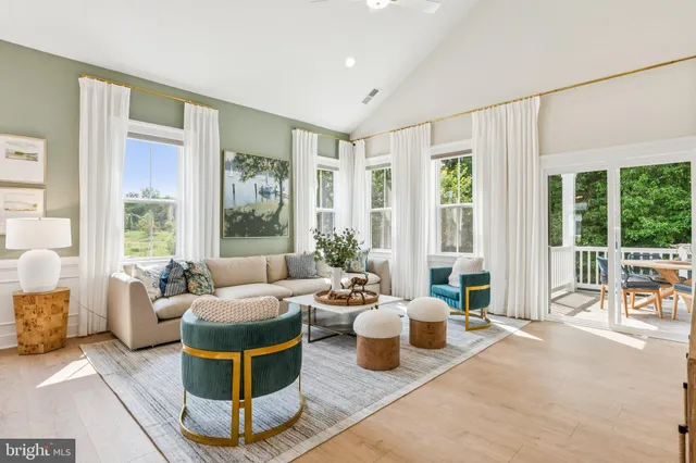 a bathroom with a sink a toilet and a large mirror