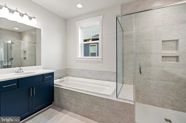 an aerial view of residential houses with outdoor space and city view