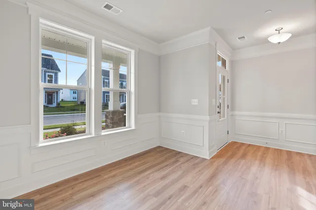 a kitchen with stainless steel appliances kitchen island wooden cabinets and granite counter tops