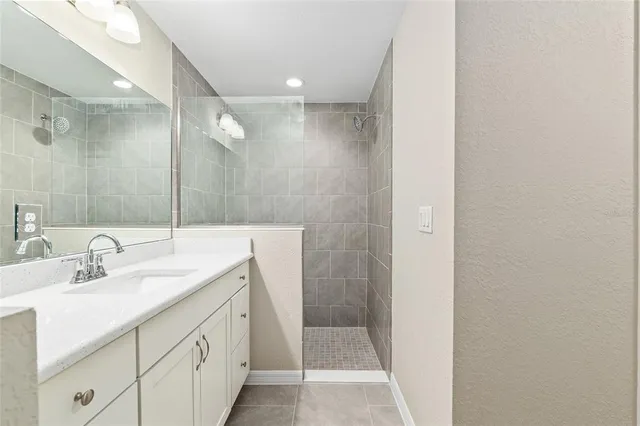 a bathroom with a double vanity sink and mirror