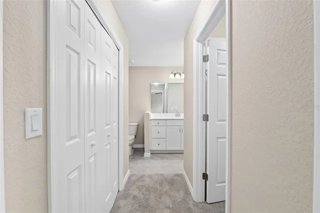a view of a hallway with closet area