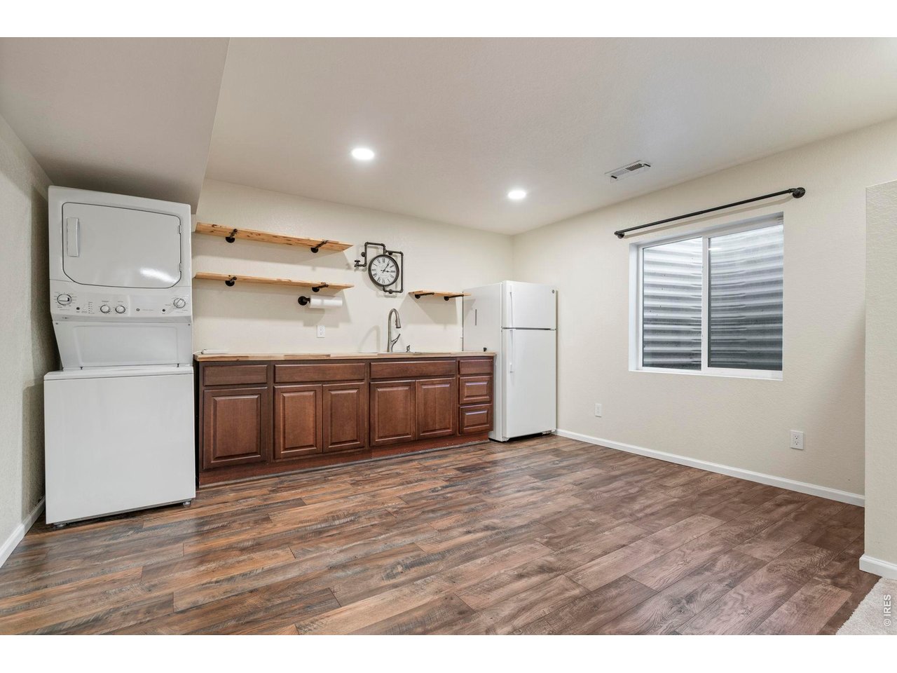 10080 Cedar Street Firestone, CO 80504 - Photo 28 of 38 Basement kitchen and dining area set up that would be perfect for multigenerational living.Washer/dryer and Refridgerator are included