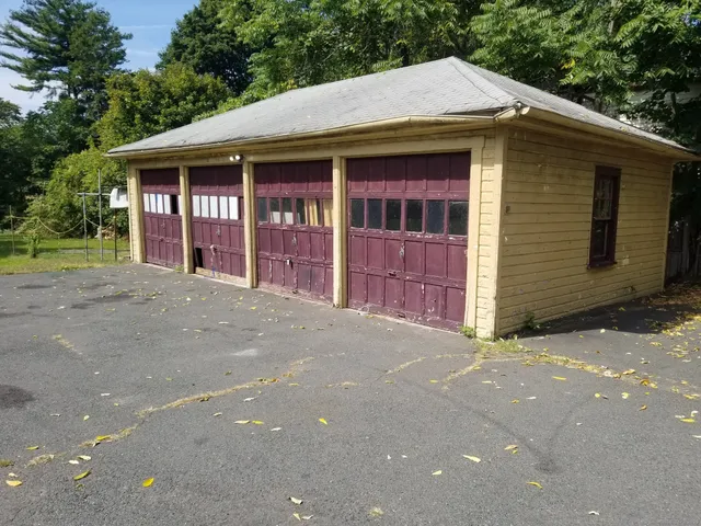 a front view of a house with a garage