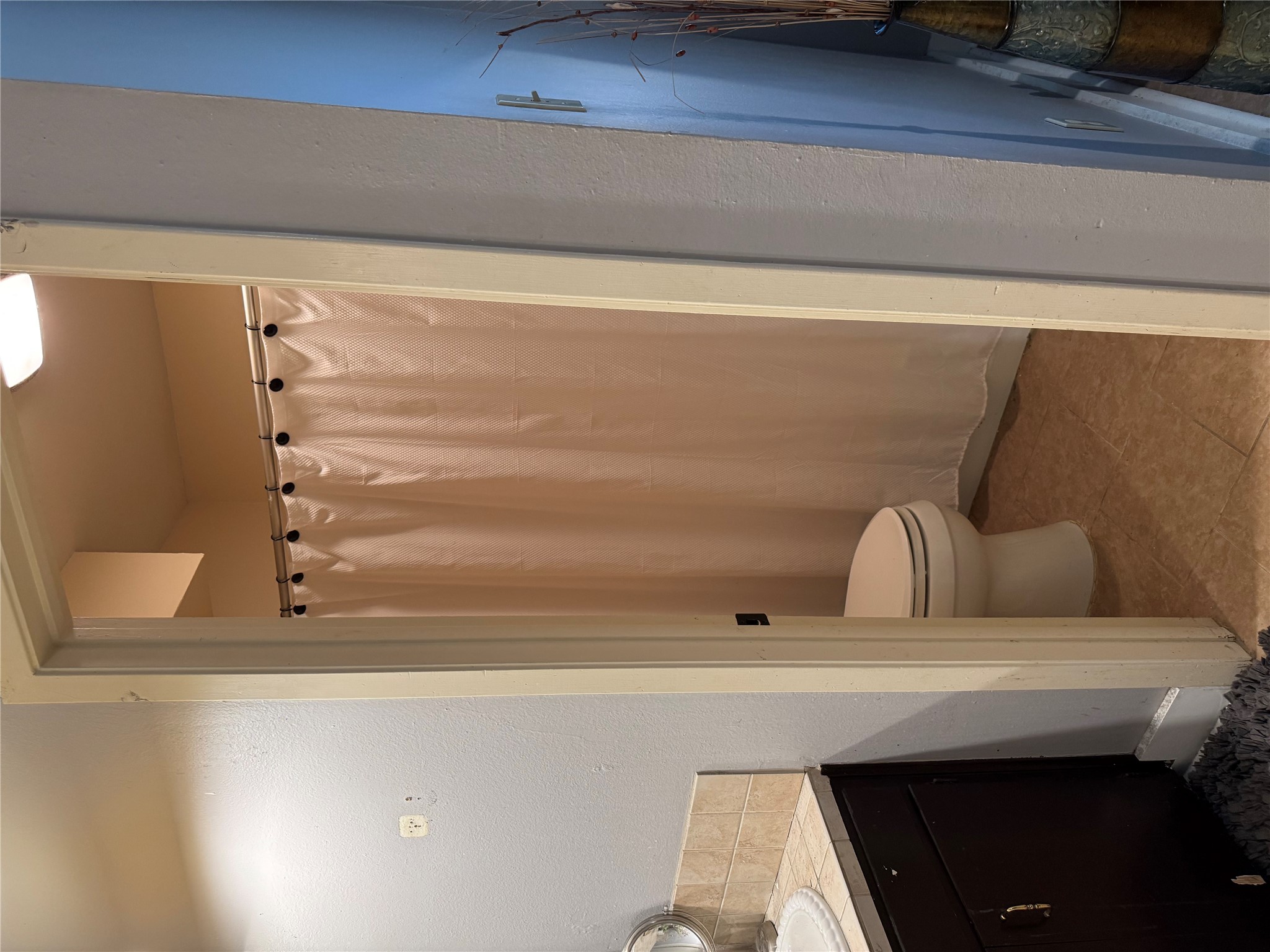 102 Skyloop Drive Austin, TX 78745 - Photo 11 of 18 a bathroom with a sink a toilet and shower