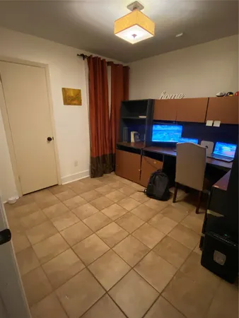 a bedroom with a bed and a cabinets