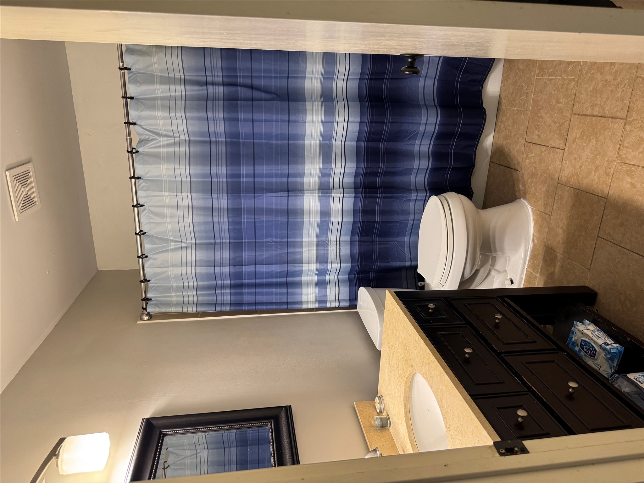 102 Skyloop Drive Austin, TX 78745 - Photo 14 of 18 a bathroom with a sink a toilet and shower