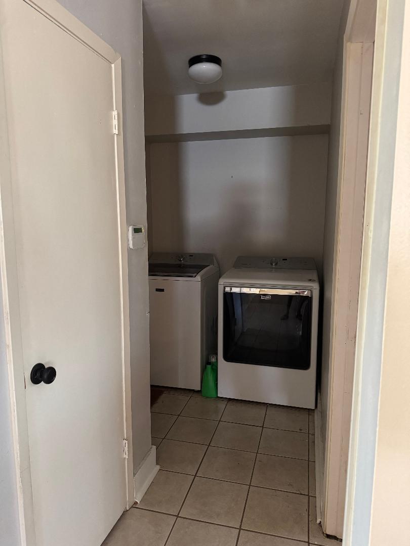 102 Skyloop Drive Austin, TX 78745 - Photo 15 of 18 a hallway with washer and dryer