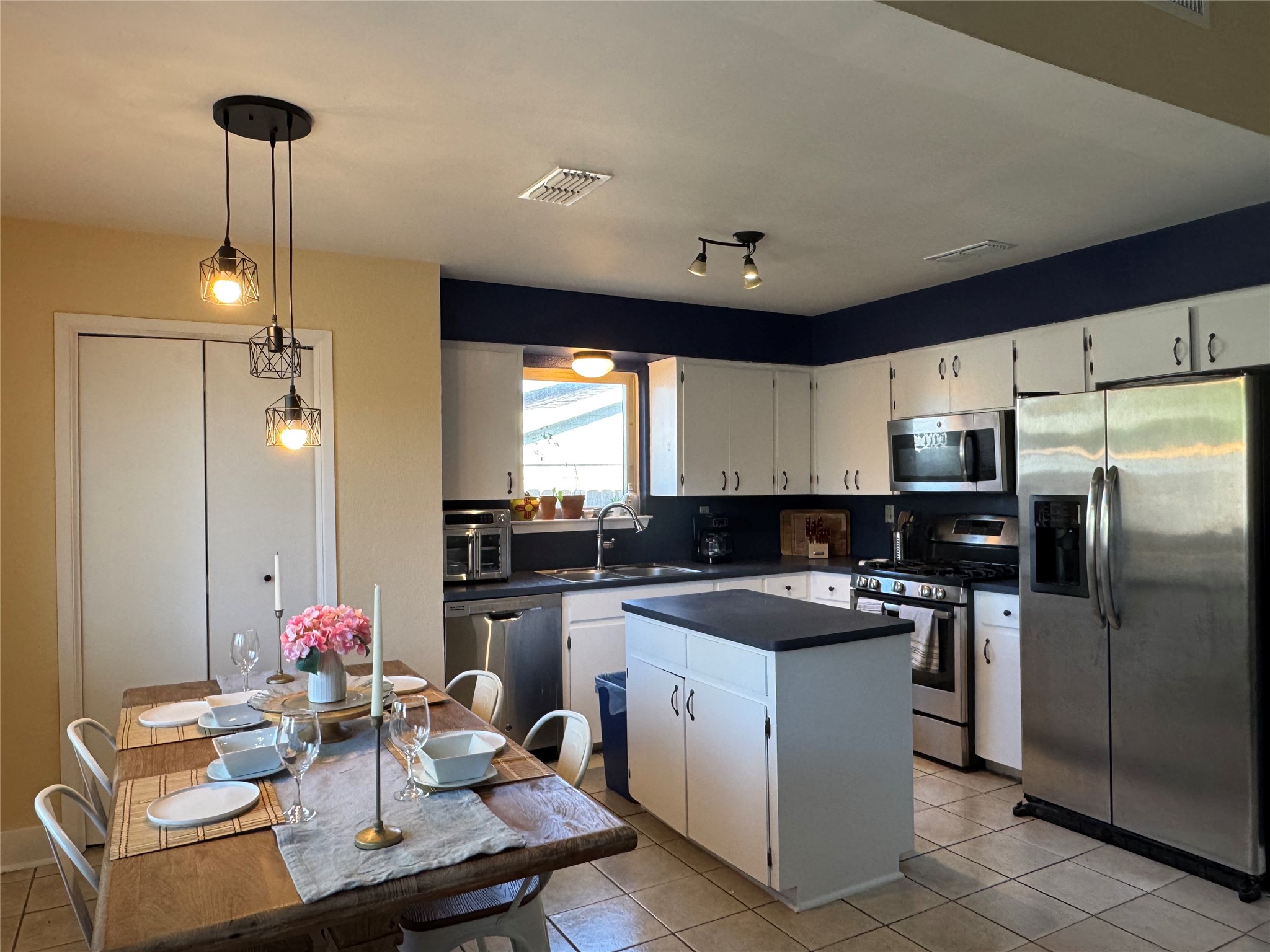 102 Skyloop Drive Austin, TX 78745 - Photo 5 of 18 a kitchen with a sink stove and refrigerator