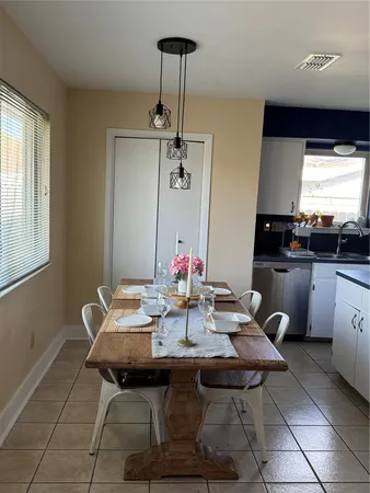 a view of a dining room with furniture and window
