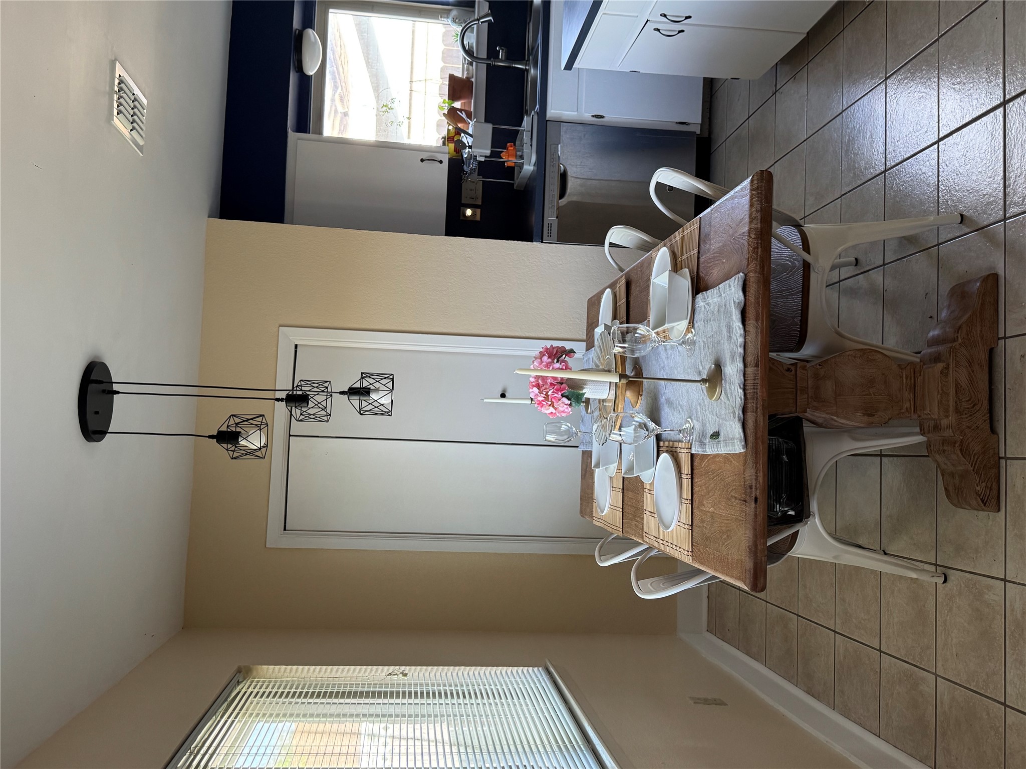 102 Skyloop Drive Austin, TX 78745 - Photo 7 of 18 a view of a dining room with furniture and window
