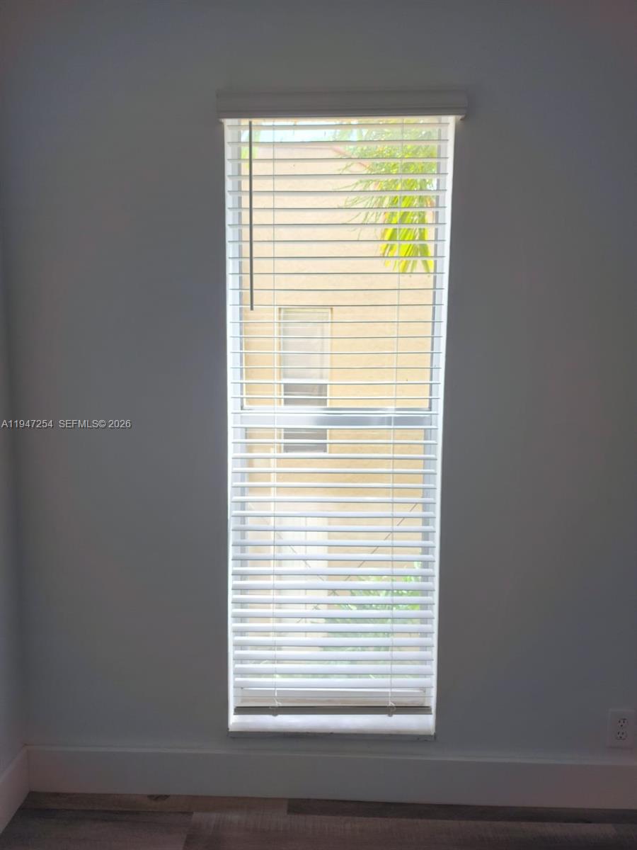 4545 Treehouse Lane, Unit H Tamarac, FL 33319 - Photo 14 of 18 a view of a small space with a window