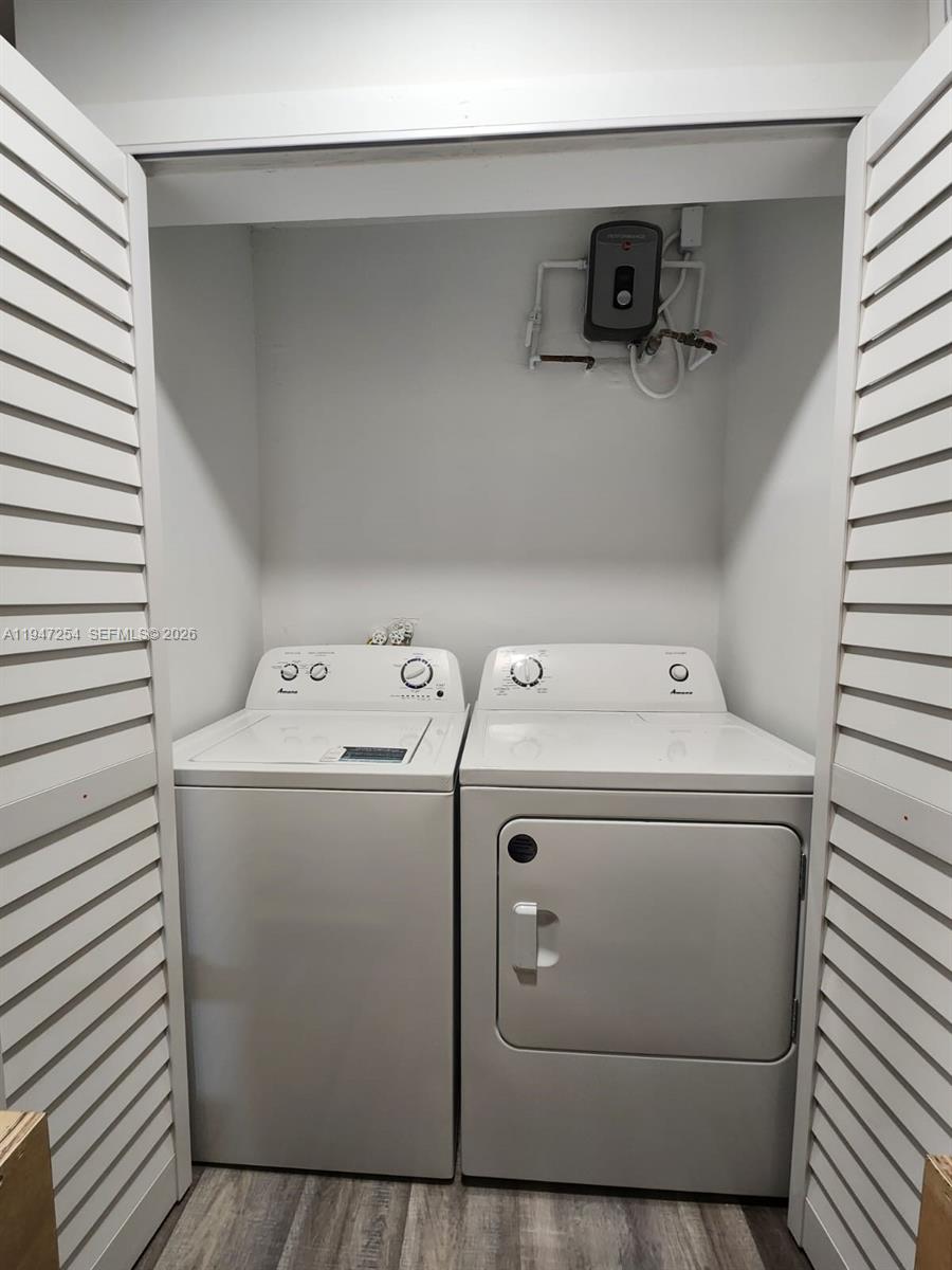 4545 Treehouse Lane, Unit H Tamarac, FL 33319 - Photo 6 of 18 a utility room with dryer and washer
