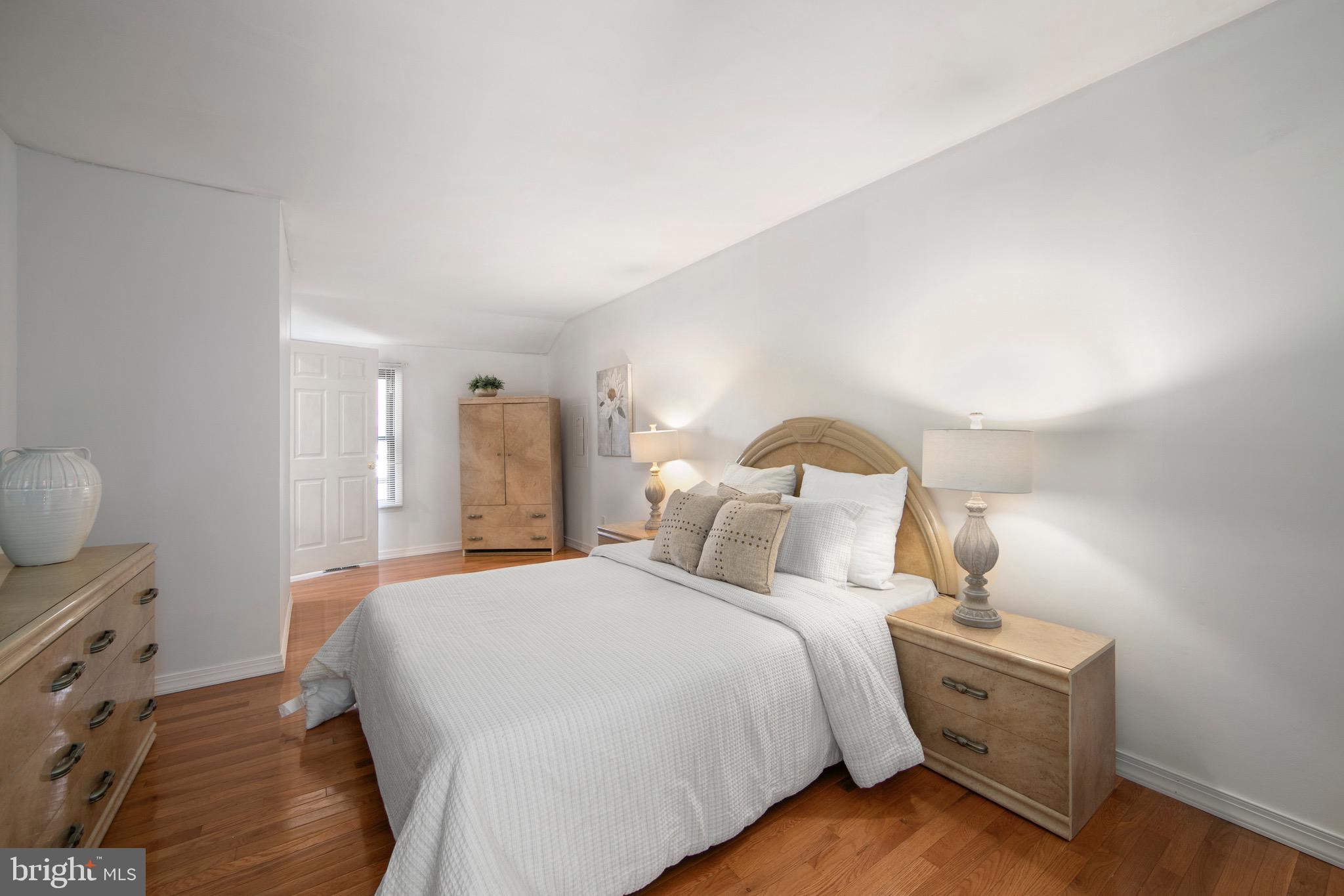 219 Dock Road Marlton, NJ 08053 - Photo 17 of 51 a bedroom with a bed and a lamp