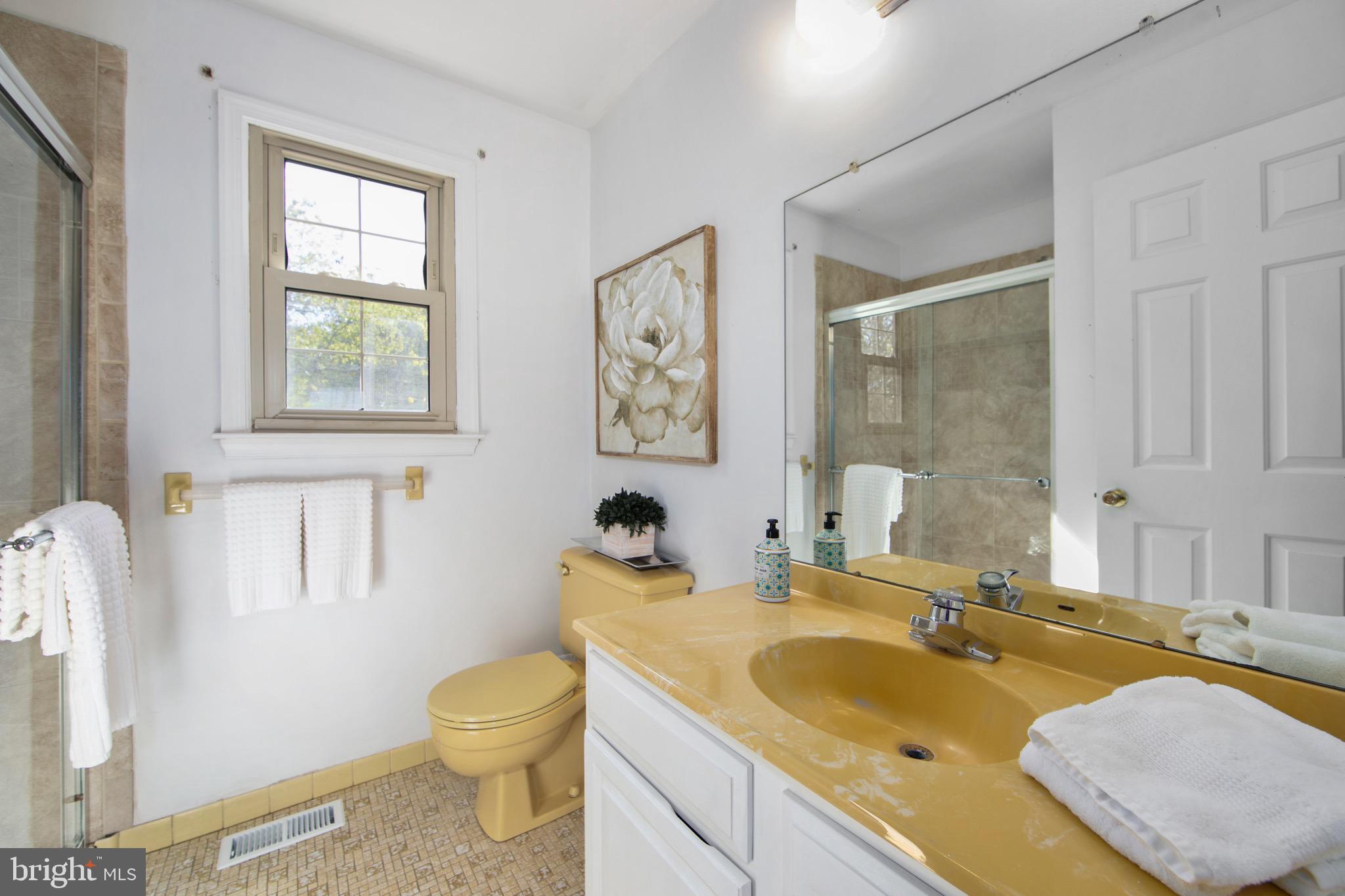 219 Dock Road Marlton, NJ 08053 - Photo 29 of 51 a bathroom with a granite countertop sink toilet and painting on the wall