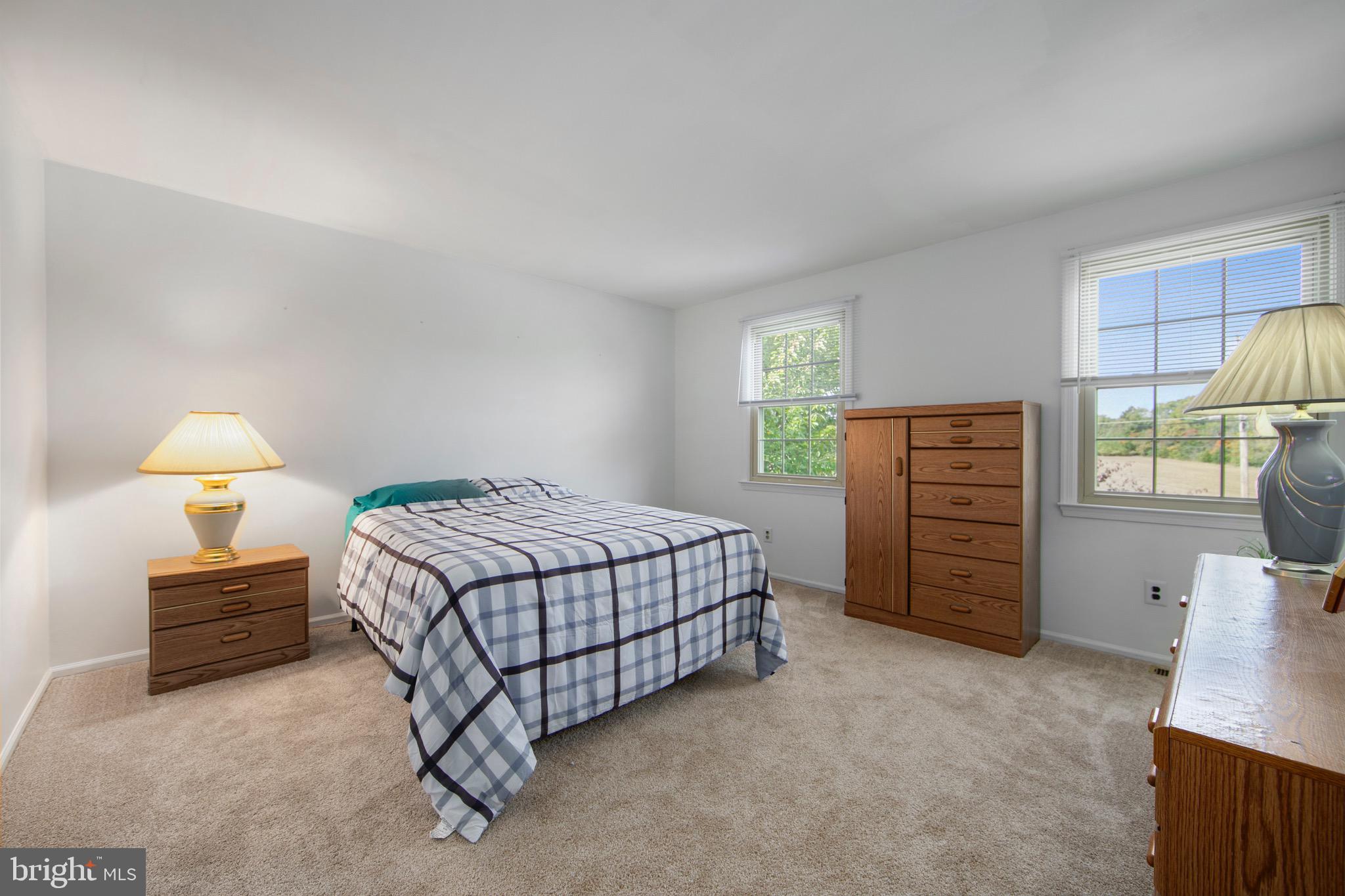 219 Dock Road Marlton, NJ 08053 - Photo 34 of 51 a bedroom with a bed and a lamp
