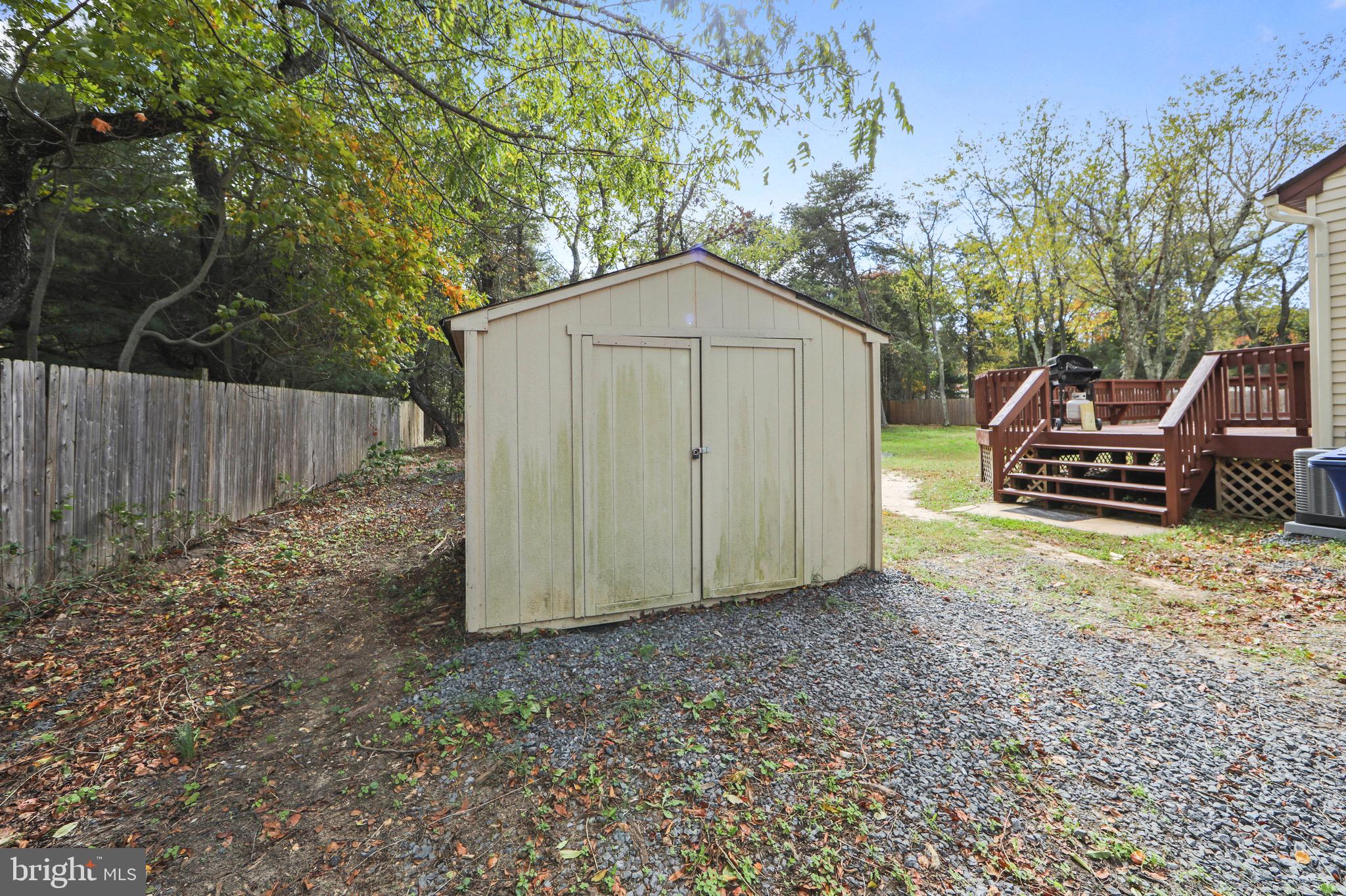 219 Dock Road Marlton, NJ 08053 - Photo 47 of 51 a backyard of a house with wooden fence and large trees