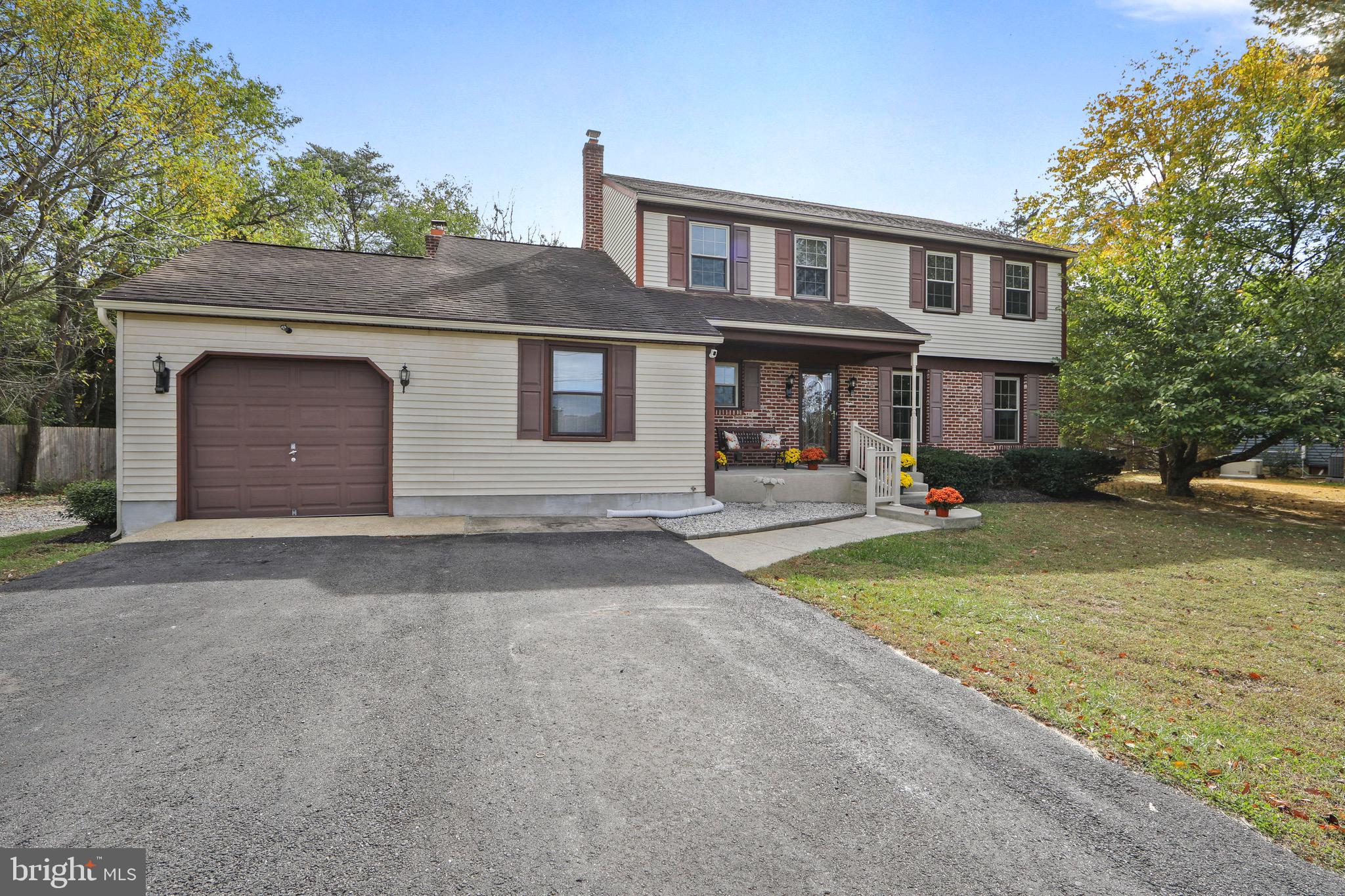 219 Dock Road Marlton, NJ 08053 - Photo 50 of 51 a front view of a house with a yard and garage