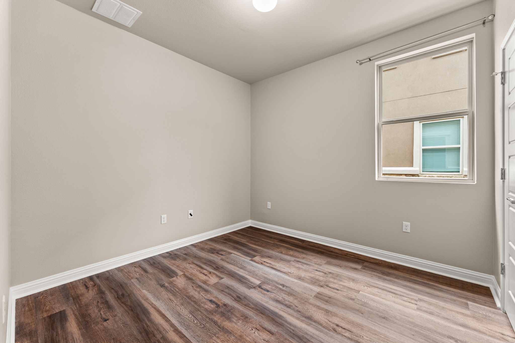 6814 East Riverside Drive, Unit 21 Austin, TX 78741 - Photo 13 of 35 an empty room with a window