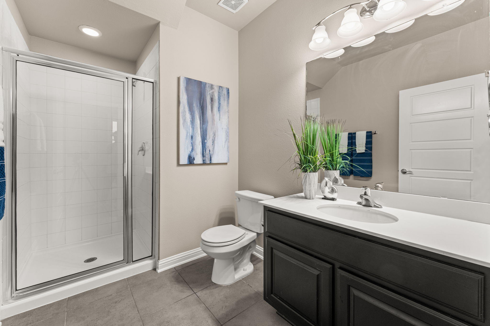 6814 East Riverside Drive, Unit 21 Austin, TX 78741 - Photo 14 of 35 a bathroom with a double vanity sink mirror and toilet