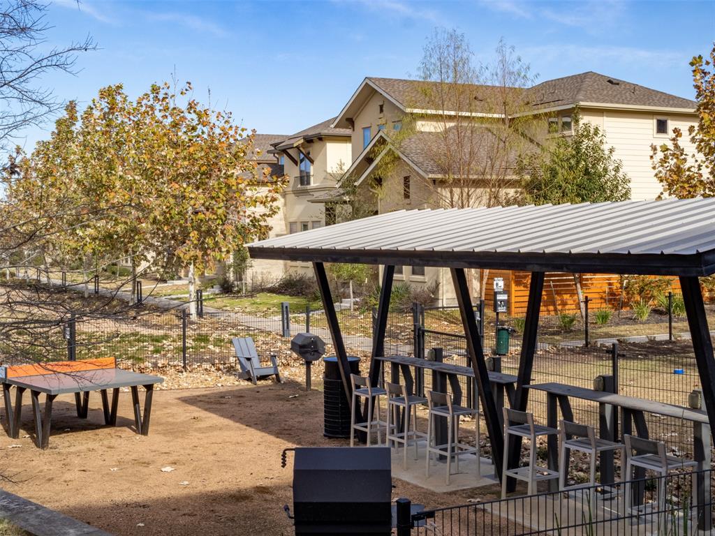 6814 East Riverside Drive, Unit 21 Austin, TX 78741 - Photo 26 of 35 a view of a chairs and table in the patio