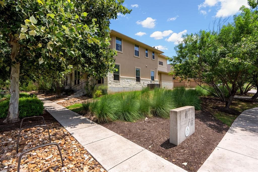 6814 East Riverside Drive, Unit 21 Austin, TX 78741 - Photo 28 of 35 a view of a house with backyard sitting area and garden