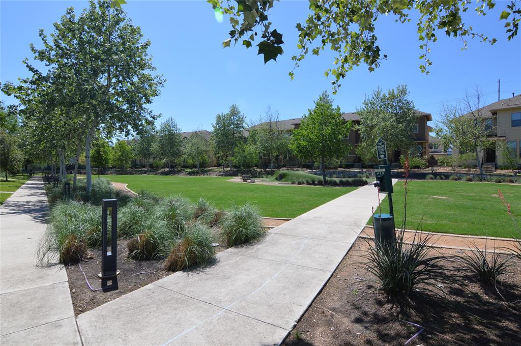 6814 East Riverside Drive, Unit 21 Austin, TX 78741 - Photo 29 of 35 a view of a park with plants and a bench