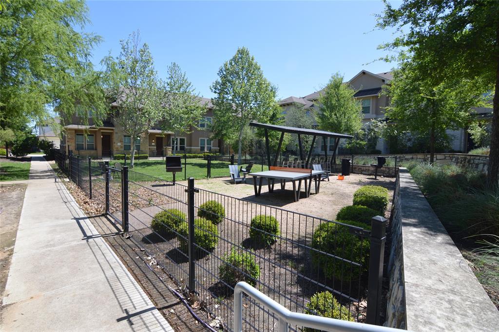 6814 East Riverside Drive, Unit 21 Austin, TX 78741 - Photo 31 of 35 a view of a patio with couches table and chairs and potted plants
