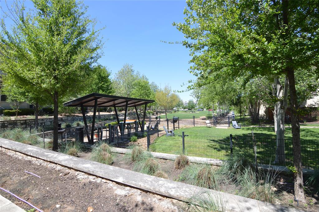 6814 East Riverside Drive, Unit 21 Austin, TX 78741 - Photo 32 of 35 a backyard of a house with yard barbeque oven and outdoor seating