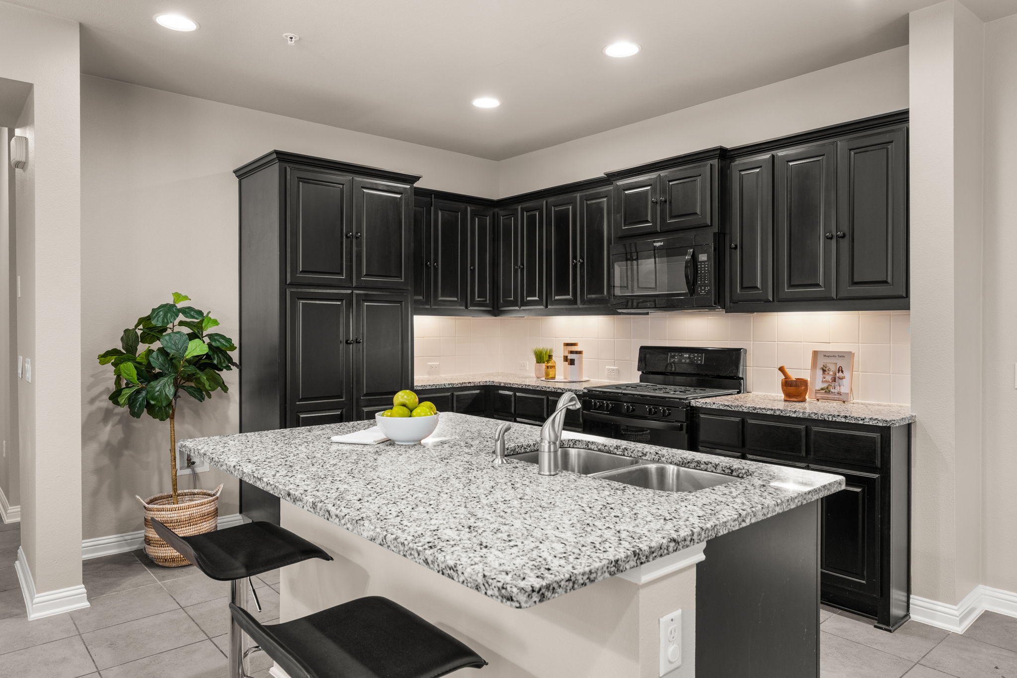 6814 East Riverside Drive, Unit 21 Austin, TX 78741 - Photo 8 of 35 a kitchen with granite countertop a sink and a stove