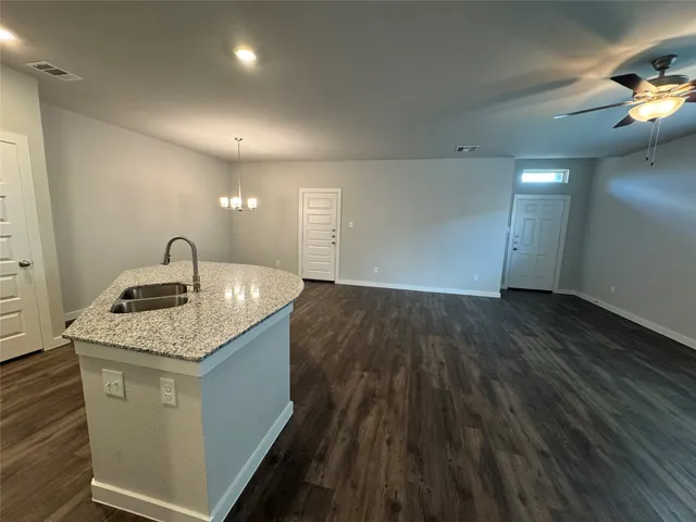 a kitchen with a sink and cabinets
