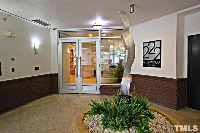 a view of a balcony with wooden fence and floor