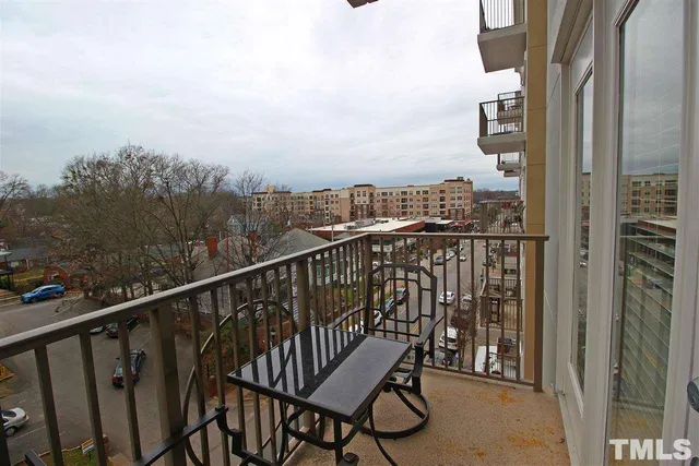 a view of balcony with wooden floor