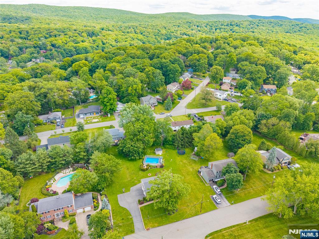 55 Marcia Road Ringwood, NJ 07456 - Photo 35 of 42 an aerial view of residential houses with outdoor space and trees all around