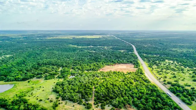 a view of a field with an ocean