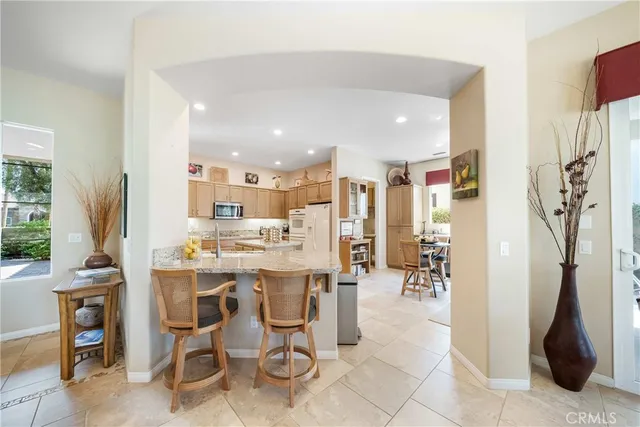 a view of a kitchen and dining room
