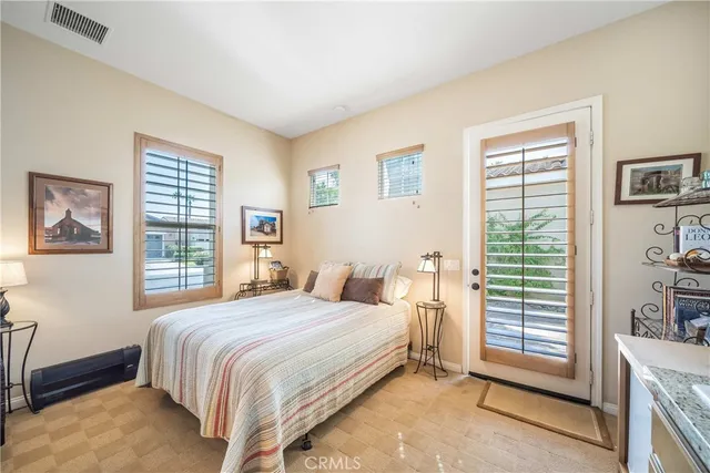 a bedroom with a bed and a couch