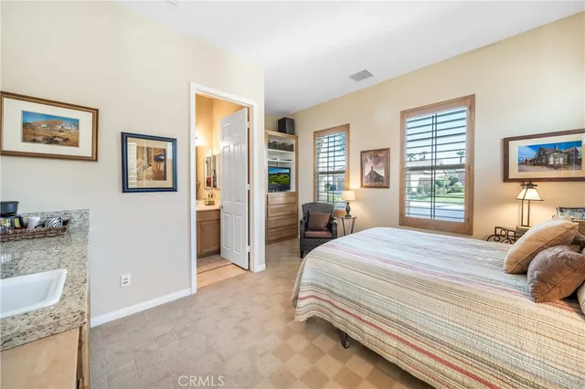 a room with a bed and a view of bathroom