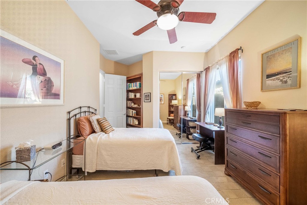 81955 Golden Star Way La Quinta, CA 92253 - Photo 26 of 54 a bedroom with a bed couch and window